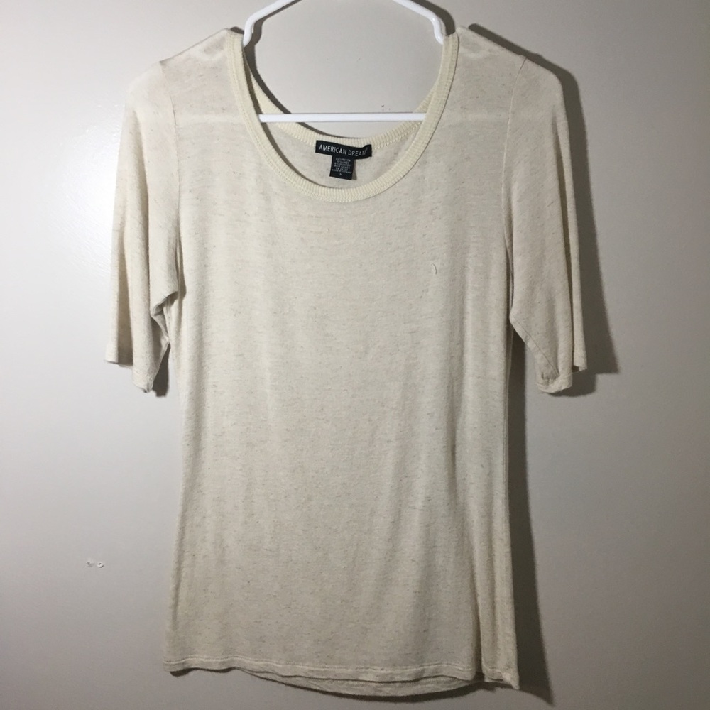 Cream mid-sleeve shirt. Lightly used.